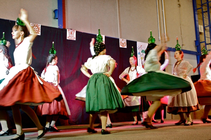 Somehow the Hungarian female performers were able to complete spinning dance moves while have a bottle of wine balanced on their heads.